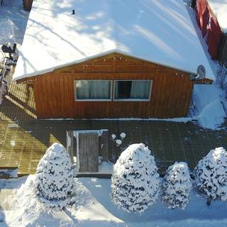 Cozy winter cottage wallpaper