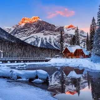 Winter alpine cabin wallpaper
