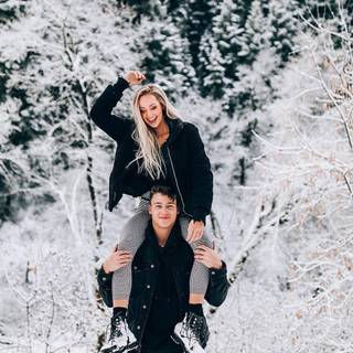 Winter couple poses wallpaper