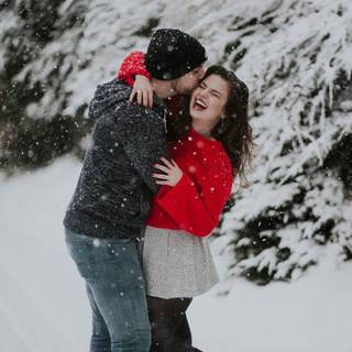 Winter couple poses wallpaper