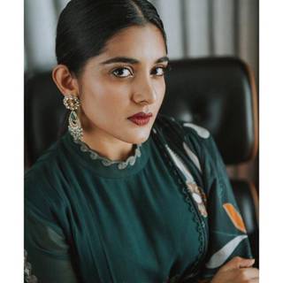 Nithya Thomas wallpaper