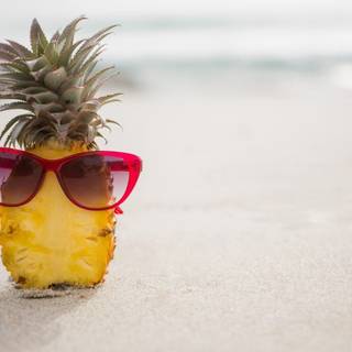 Pinnaple on beach wallpaper
