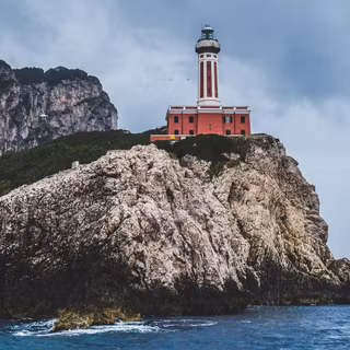 Rocky cliff lighthouse wallpaper
