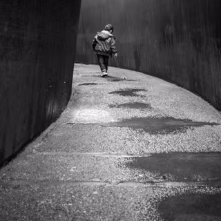 Alone boy walking on road wallpaper