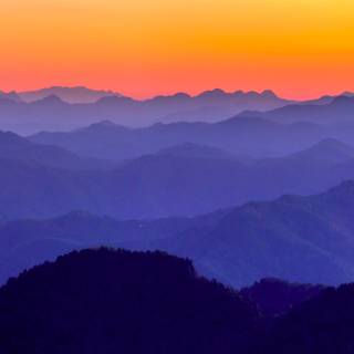 Orange and blue mountains 4k wallpaper