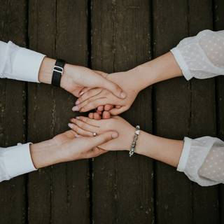 Women holding hands wallpaper