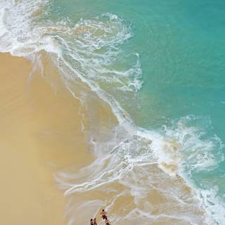 Aerial view beach sand and ocean waves wallpaper