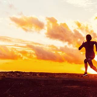 Couple running in sunset wallpaper