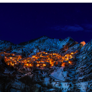 Mountain winter village wallpaper