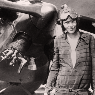 Amelia earhart stands near the friendship  