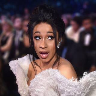 cardi b i love your white dress and black hairstyle