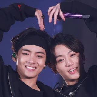 v and JK doing a heart 