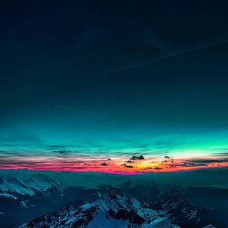 Mountains with a Northern Lights sunset