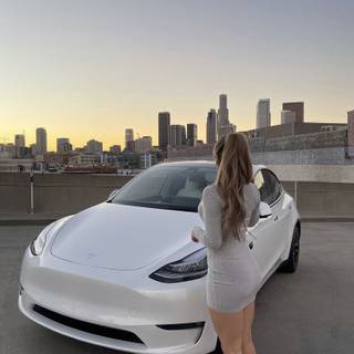 She just love being in front of the Tesla 