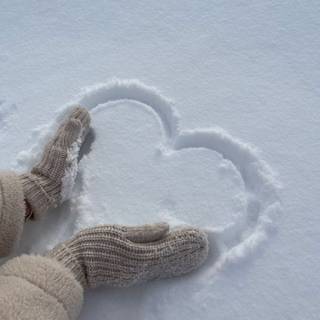 heart in snow being made