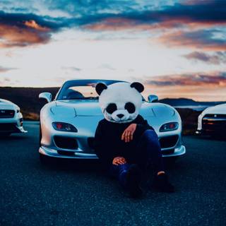 Panda dude infront of cars