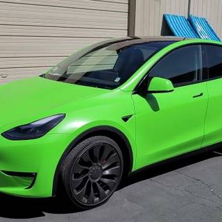 A Fancy green Tesla Model 3!!! I love It!