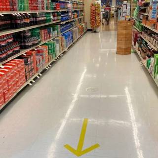 grocery aisle with arrow