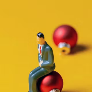 Man sitting on an ornament