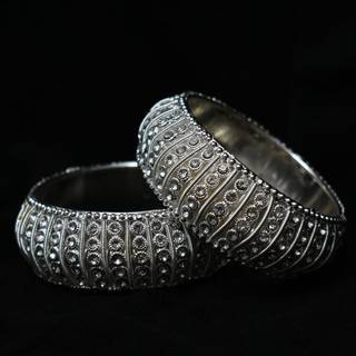 Two bangles in black background 