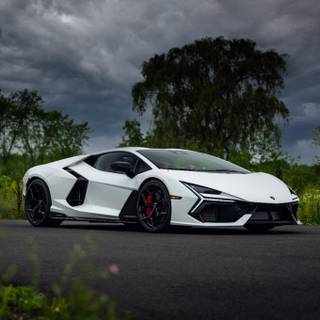 White lamborghini next to trees