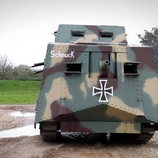 a real life picture of me finally getting to drive the German A7V back from WW1 fully restored guns work and everything