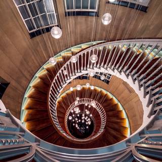 spiral staircase steps wooden lights look down descent