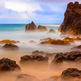 Sea Mist Over The Rocky Shore