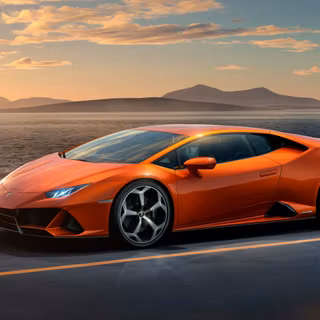 Luxury Orange Lamborghini Huracan EVO On Scenic Road