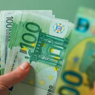 100 Euro Banknotes In Hands