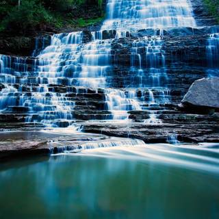 Waterfall Flowing Over Rocks