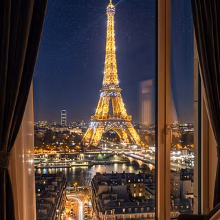 Window View of the Eiffel Tower at Night