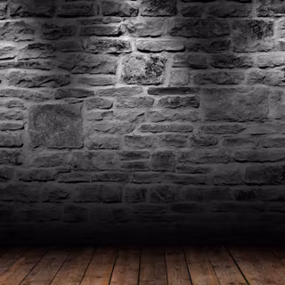 Download A Dark Room With A Stone Wall And Wooden Floor 