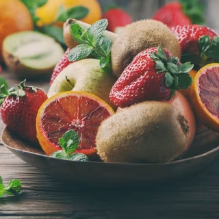 Mix of fresh fruits on the wooden table