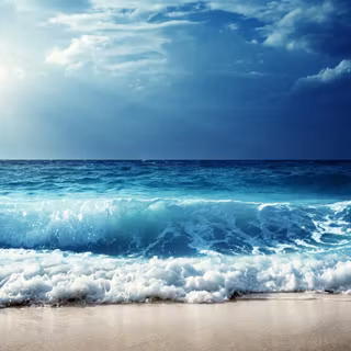 The ocean waves are crashing on the beach