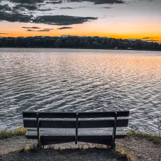 Sunset View From A Lakeside Bench