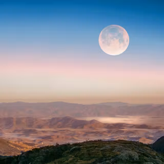 Full Moon Rising Over Misty Mountains