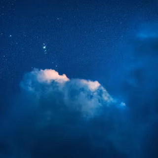 Clouds Drifting Through A Starry Night