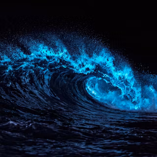 Bioluminescent Wave Crashing At Night
