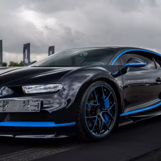 Bugatti Chiron Black and Blue Hypercar Under Dramatic Skies
