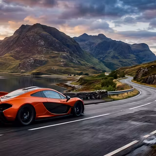 McLaren P1 Sunset Coastal Mountain Drive - A striking cinematic photography shot of a metallic volcano orange McLaren P1 hypercar cruising along a winding coastal road at sunset, framed by rugged green mountain peaks, calm lake water, and dramatic cloud formations.