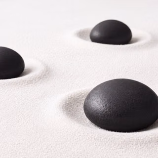 Minimalist Black Zen Stones in White Sand