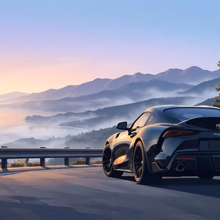 Dawn Misty Coastal Drive Toyota GR Supra - A serene vector illustration of a sleek black Toyota GR Supra parked on a mountain cliffside road at sunrise, overlooking soft morning fog lingering over a calm ocean bay and distant mountain ridges.