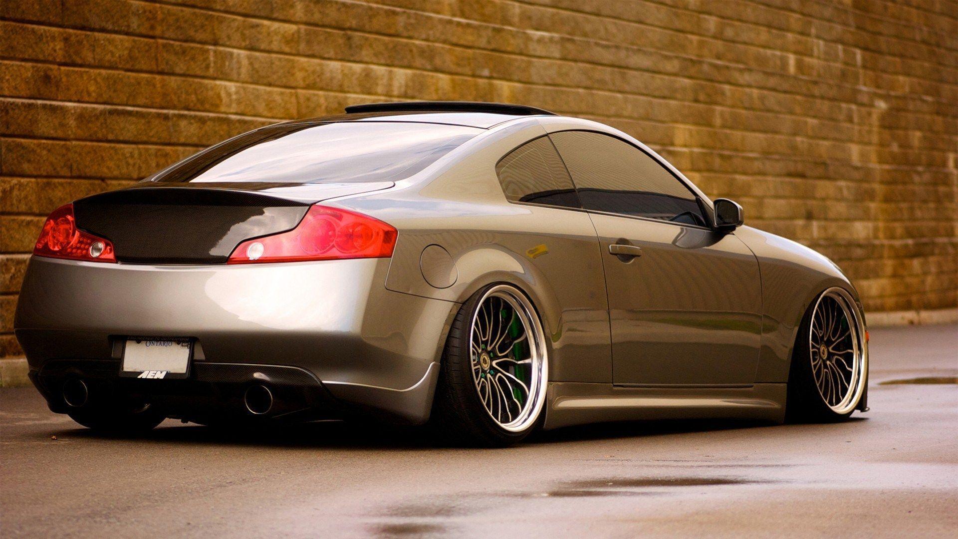 g35 infiniti tuning parked next to brick wall wide HD wallpaper
