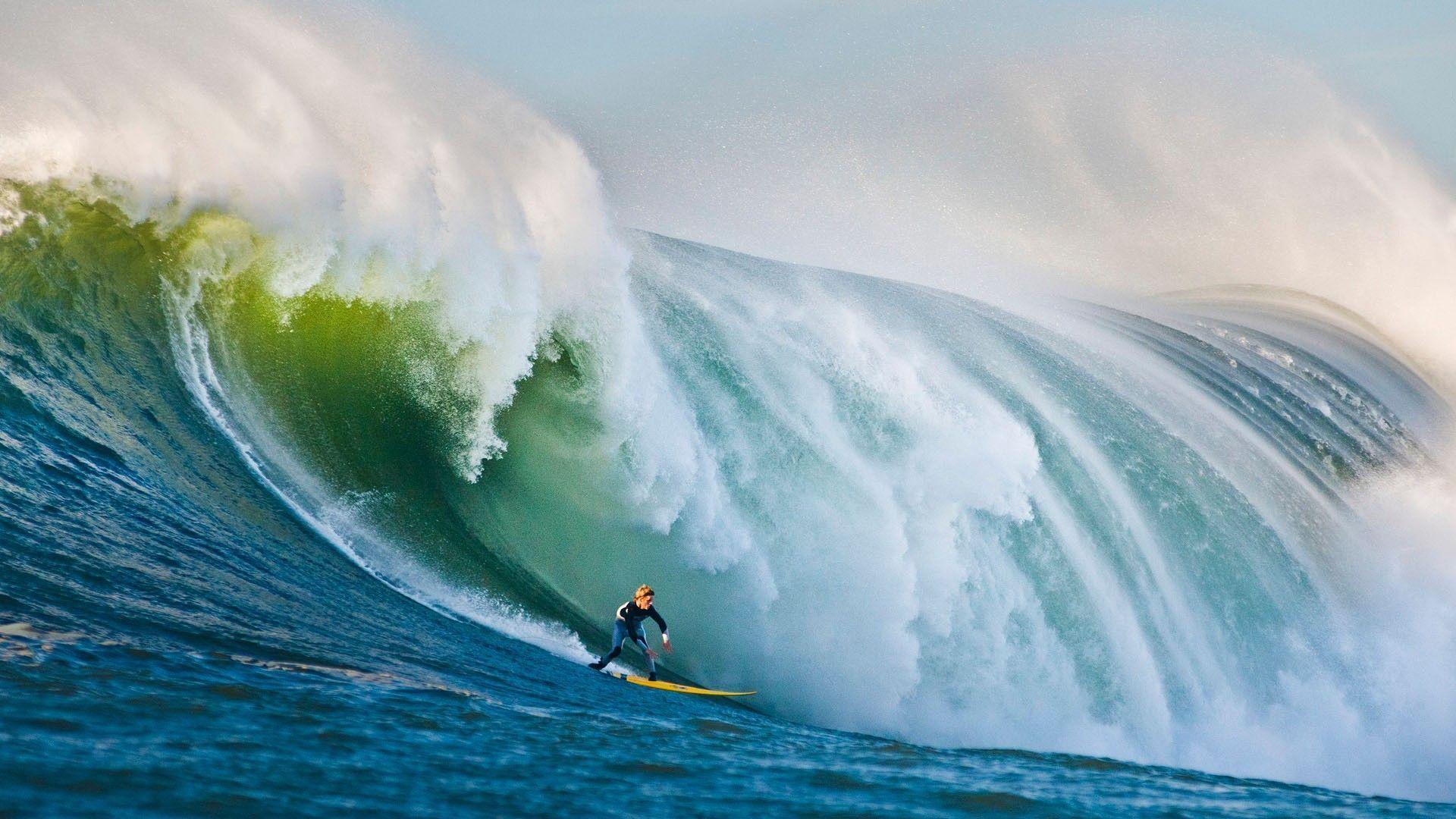 Surfing on Huge Waves Wallpaper