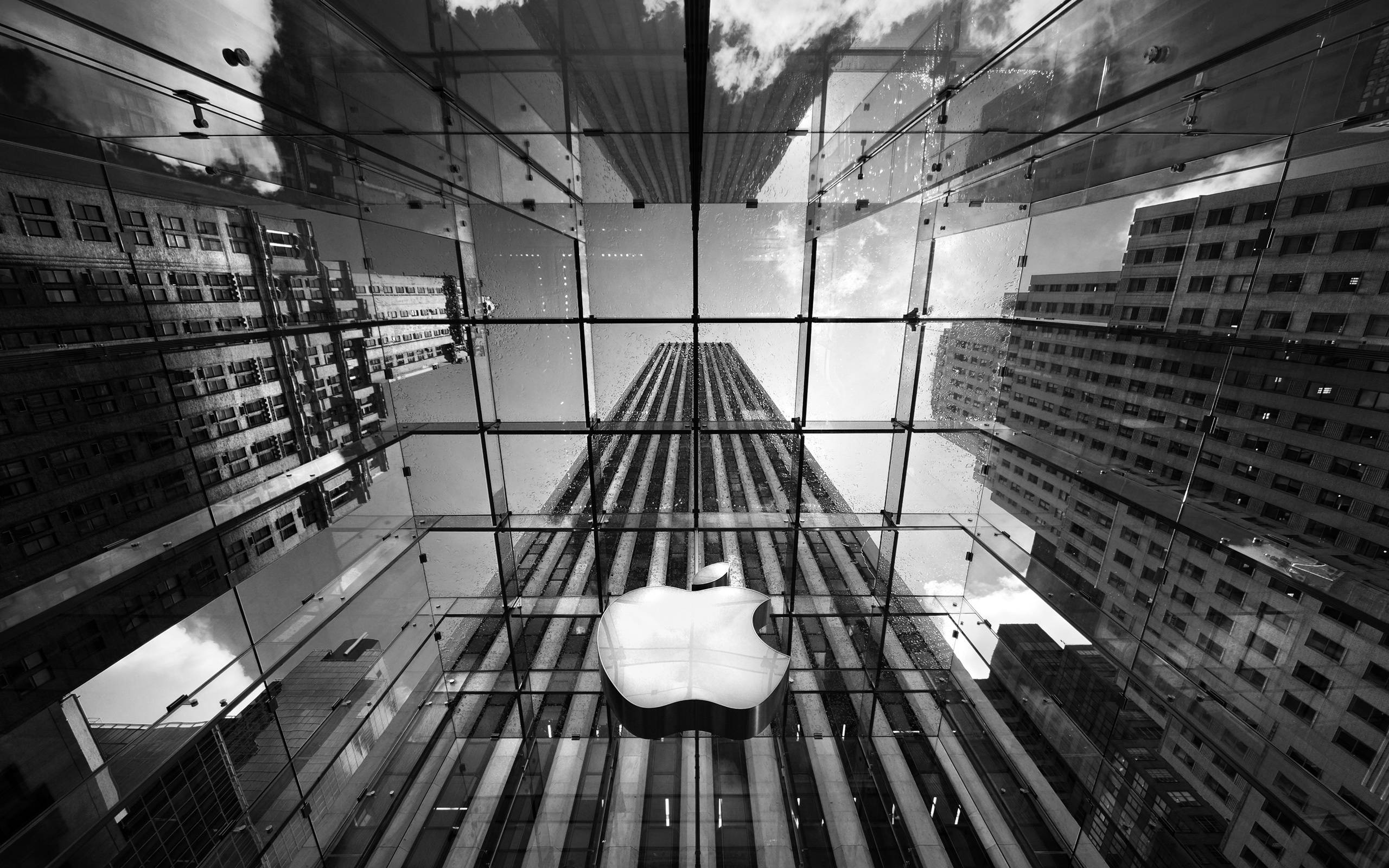 Apple Sign on Building in Black and White Free Stock Photo and