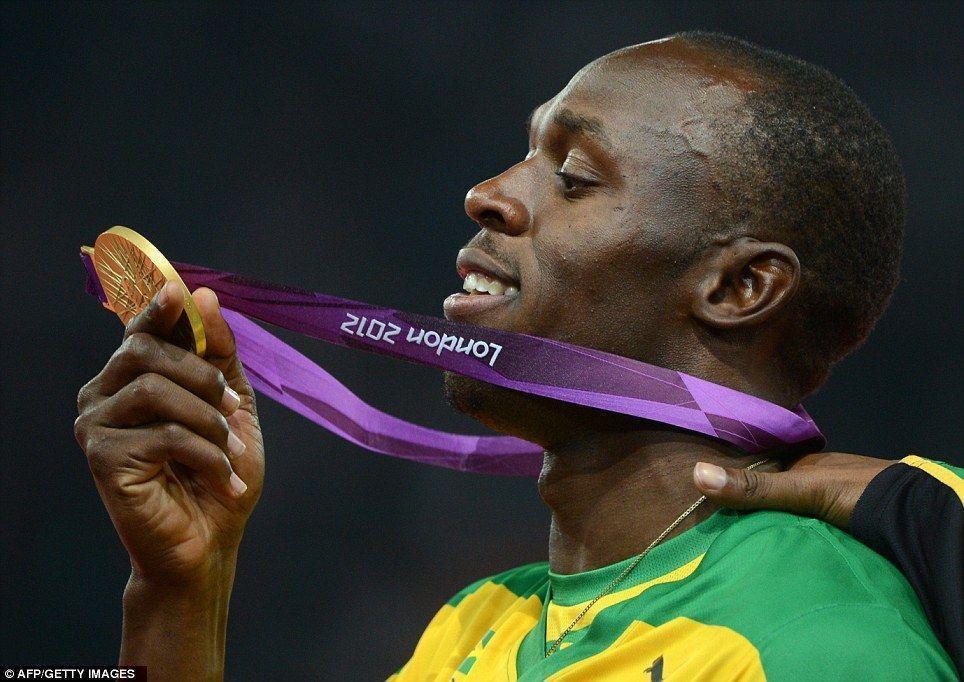London 2012 Olympics: Usain Bolt grabs a camera and snaps his own