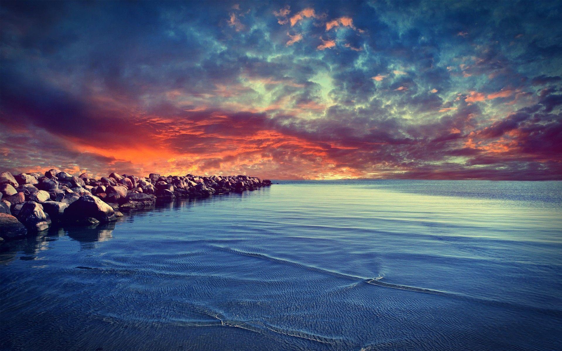 Beautiful Sunset And Stone On Beach Wallpaper Wallpaper