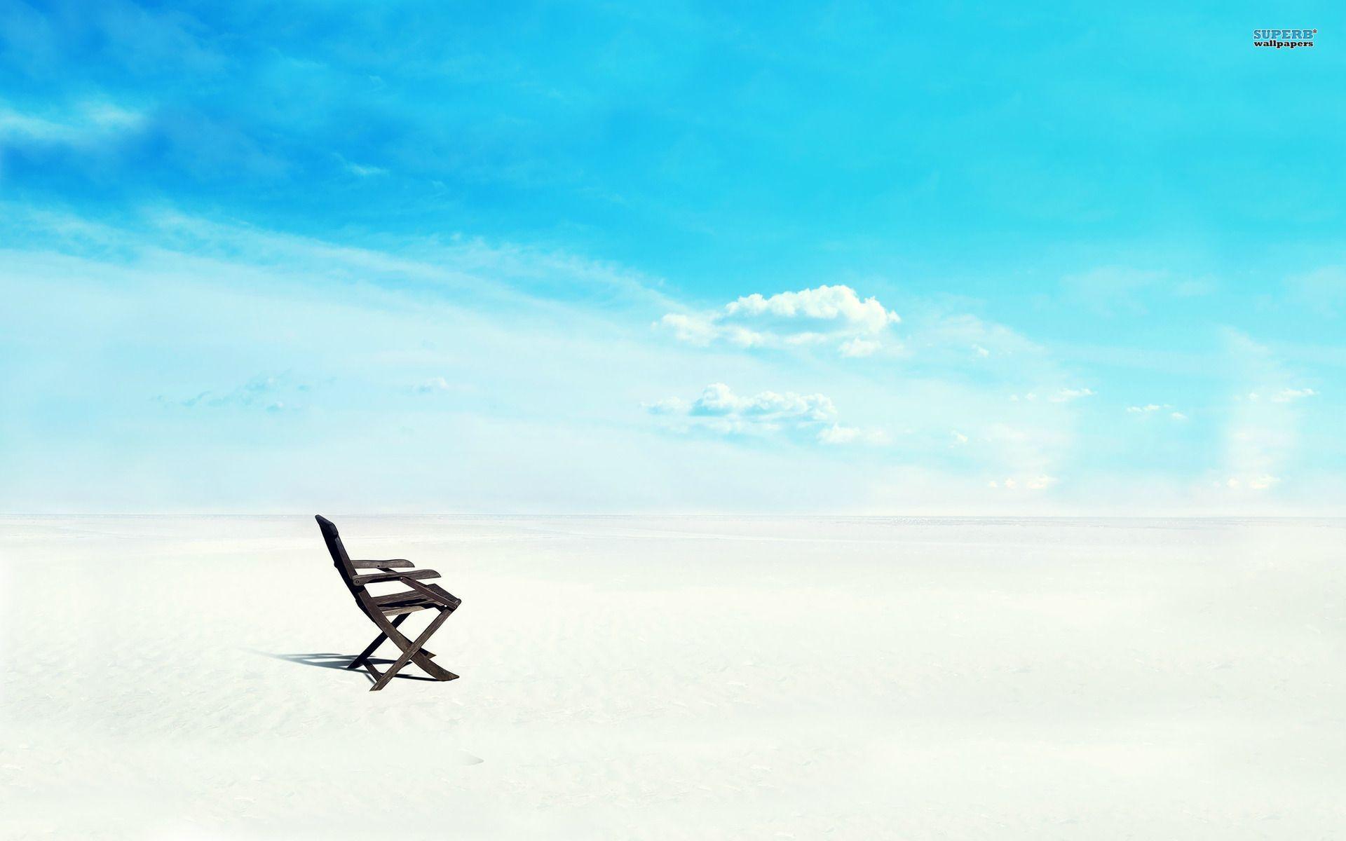 Beach chair on white sand wallpapers