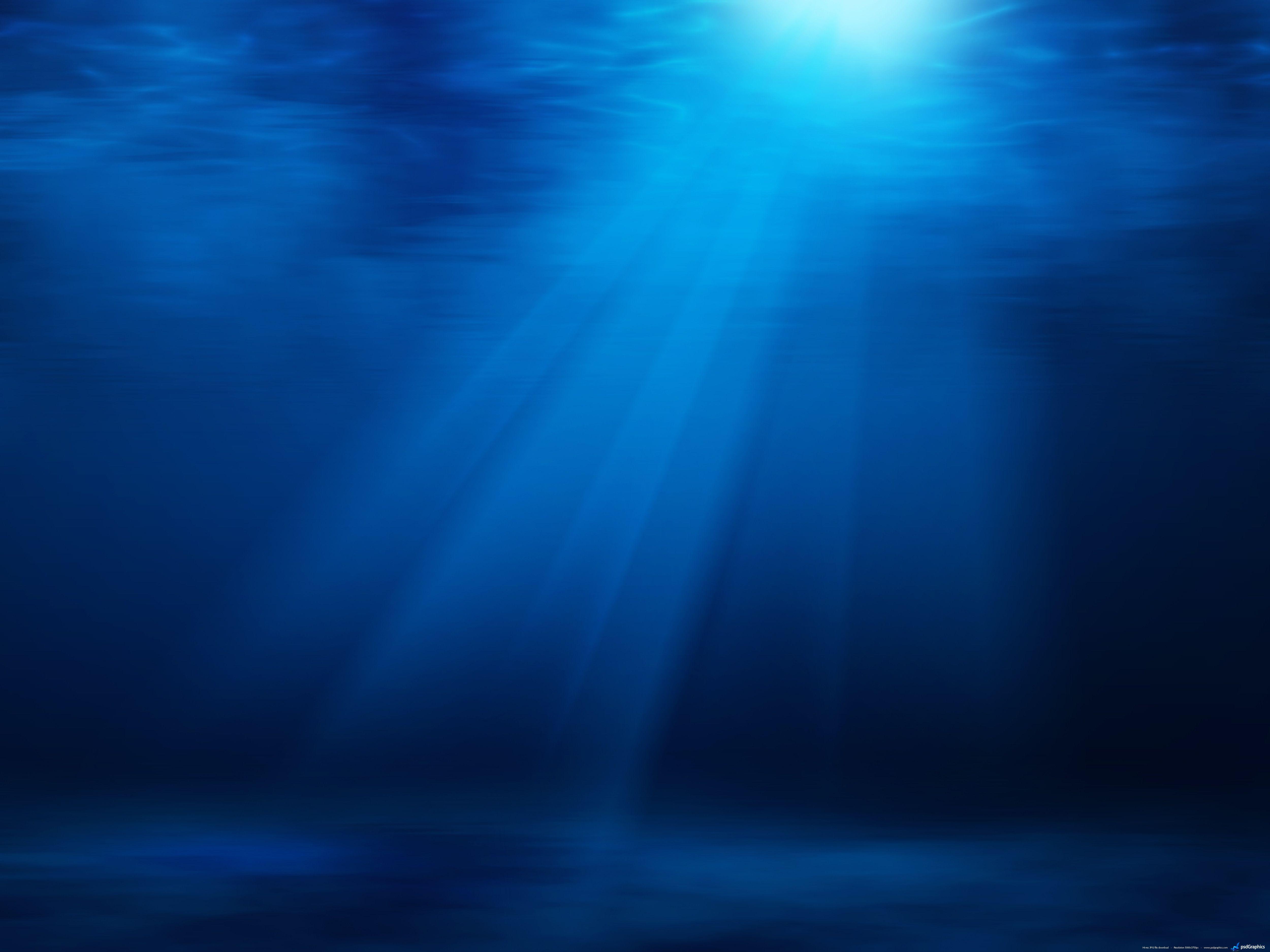 Blue underwater with sun rays background